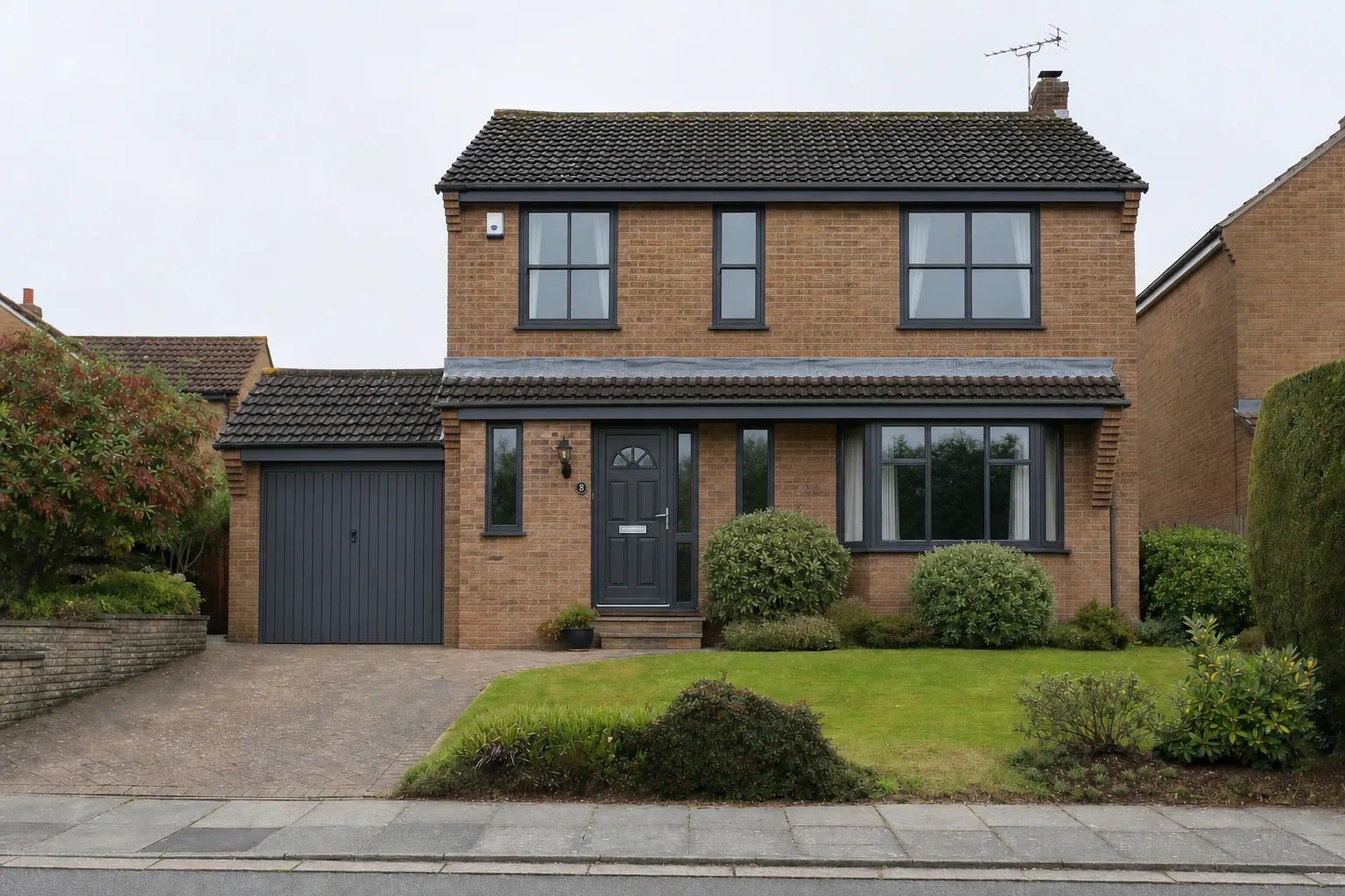 Detached Yorkshire brick house — Anthracite Grey flush sash windows and front door installed