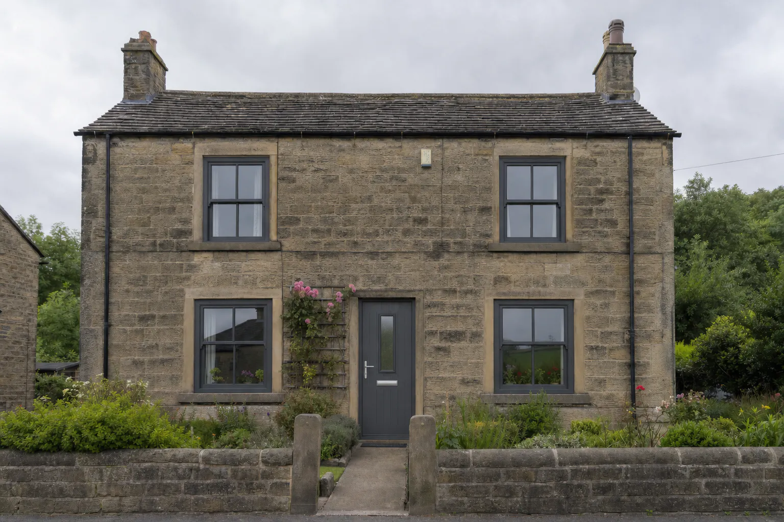 1950s detached Yorkshire stone house — Anthracite Grey flush sash windows installed