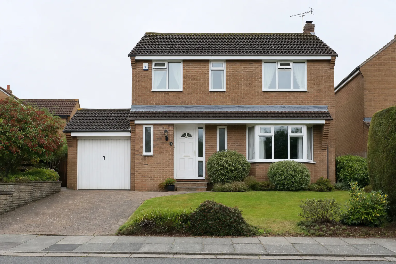 Detached Yorkshire brick house — tired old windows before replacement