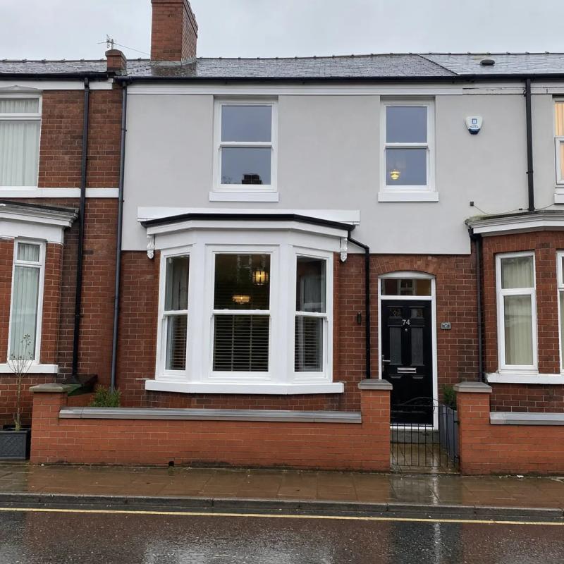Victorian bay-fronted house with uPVC casement windows, Yorkshire town